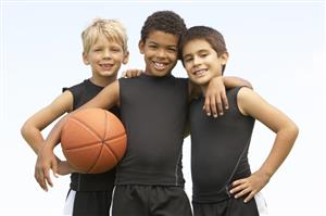 Children posing with basketball